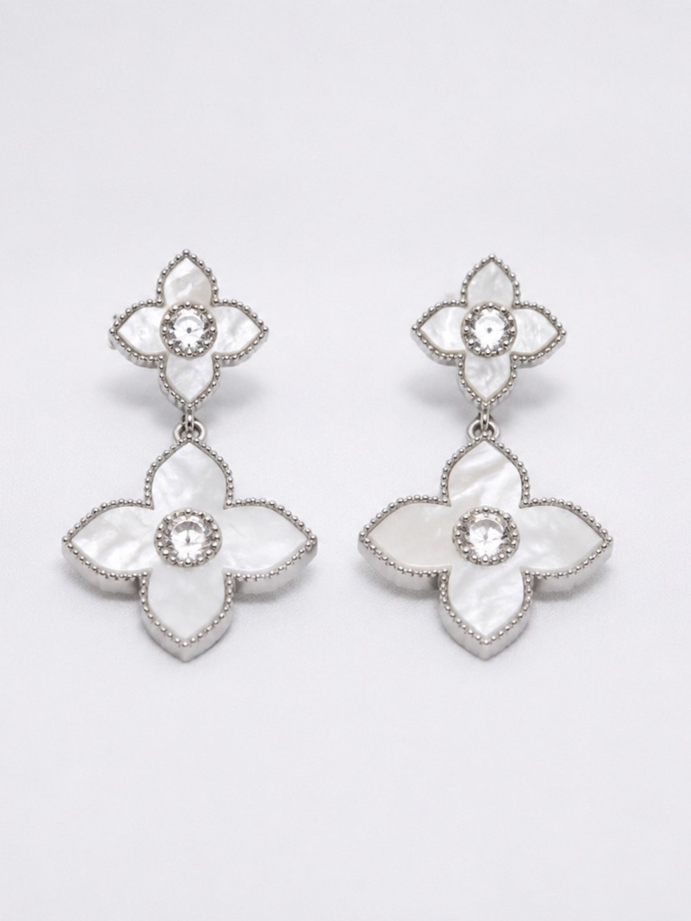 1” mother of pearl and cz dangle earrings.